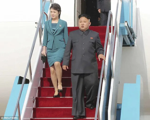 1DC62D5400000578-3159101-The_real_deal_North_Korean_leader_Kim_Jong_Un_and_his_wife_Ri_So-a-7_1436785885059